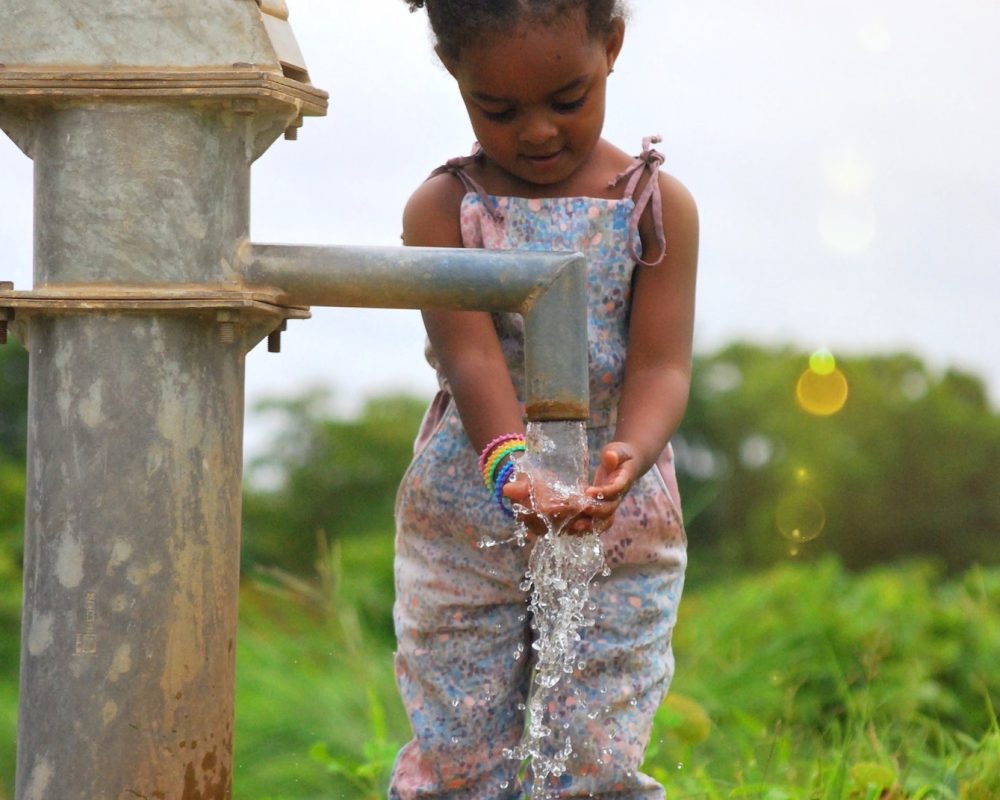 girl-washing-her-hands-at-a-water-well-in-burkina-faso-africa.jpg